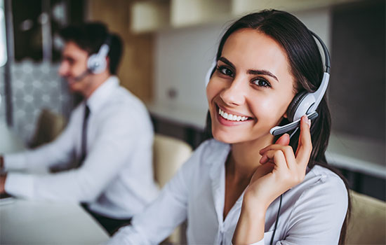 smiling customer service representative on headset