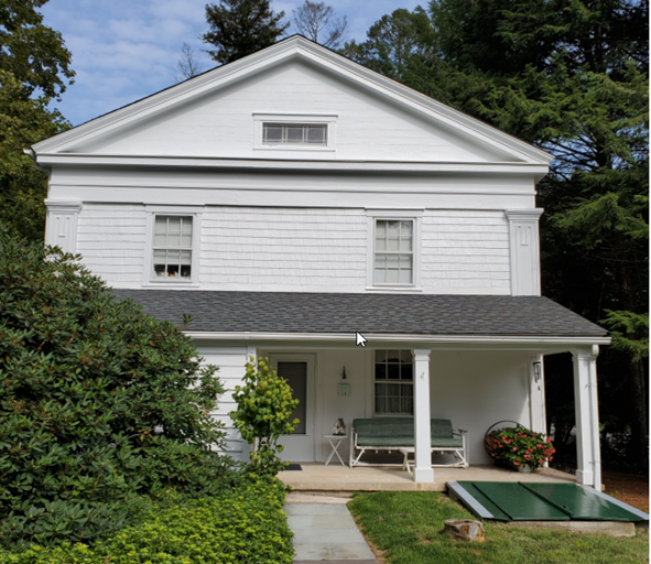 front lawn of white, 1800s colonial house